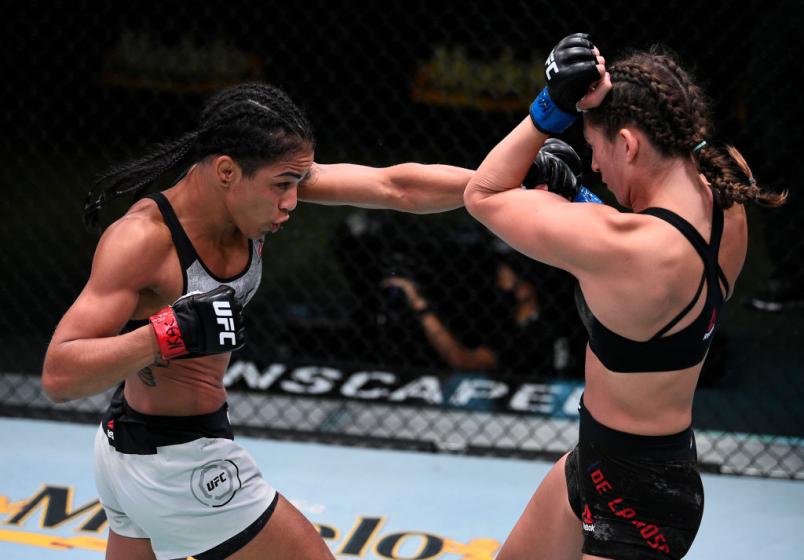LAS VEGAS, NEVADA - SEPTEMBER 05: (L-R) Viviane Araujo of Brazil punches Montana De La Rosa in a flyweight fight during the UFC Fight Night