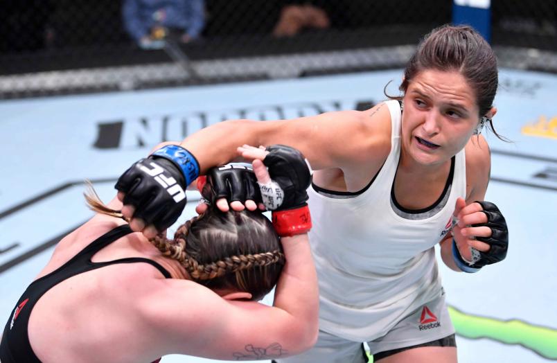 Lara Procopio of Brazil punches Molly McCann of England in their flyweight fight during the UFC Fight Night event at UFC APEX on February 06, 2021 in Las Vegas, Nevada. (Photo by Chris Unger/Zuffa LLC)