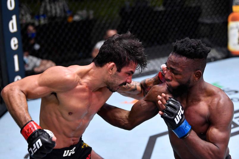 Alexandre Pantoja of Brazil and Manel Kape of Angola trade punches in their flyweight fight during the UFC Fight Night event at UFC APEX on February 06, 2021 in Las Vegas, Nevada. (Photo by Chris Unger/Zuffa LLC)