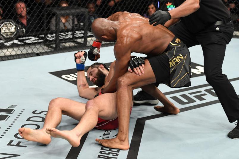 JACKSONVILLE, FLORIDA - APRIL 24: (R-L) Kamaru Usman of Nigeria punches Jorge Masvidal in their UFC welterweight championship bout during the UFC 261 