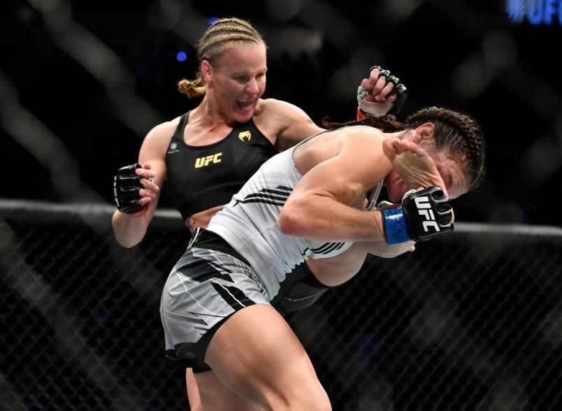 LAS VEGAS, NEVADA - SEPTEMBER 25: (L-R) Valentina Shevchenko of Kyrgyzstan punches Lauren Murphy in their UFC flyweight championship fight during the UFC 266 event on September 25, 2021 in Las Vegas, Nevada.