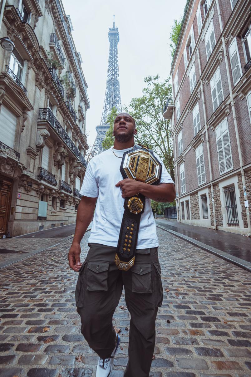 Interim heavyweight champion Ciryl Gane poses with his belt in front of the Eiffel Tower in Paris, France. (Photo by John Barry/Zuffa LLC)