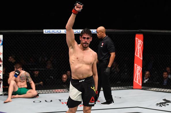 LAS VEGAS, NV - DECEMBER 30: Antonio Carlos Junior of Brazil (center) reacts to his victory over Marvin Vettori of Italy (left) in their middleweight bout during the UFC 207 event at T-Mobile Arena on December 30, 2016 in Las Vegas, Nevada. (Photo by Jef