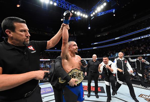 LAS VEGAS, NV - JULY 08: Robert Whittaker of New Zealand celebrates his victory over Yoel Romero of Cuba in their interim UFC middleweight championship bout during the UFC 213 event at T-Mobile Arena on July 8, 2017 in Las Vegas, Nevada. (Photo by Josh