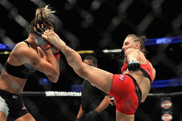 ANAHEIM, CA - JULY 29: Kailin Curran (Black Shorts) fights Alexandra Albu of Russia during their Woman Strawweight fight at UFC 214 at Honda Center on July 29, 2017 in Anaheim, California. (Photo by Sean M. Haffey/Getty Images)