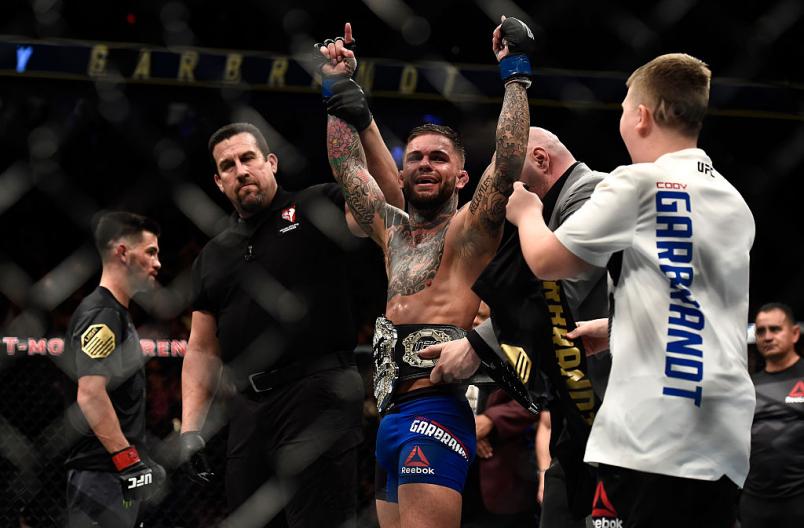 LAS VEGAS, NV - DECEMBER 30: (R-L) Cody Garbrandt celebrates his victory over Dominick Cruz during the UFC 207 event at T-Mobile Arena on December 30, 2016 in Las Vegas, Nevada. (Photo by Brandon Magnus/Zuffa LLC/Zuffa LLC via Getty Images)