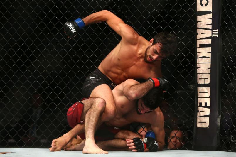 NEW YORK, NY - NOVEMBER 04: Ricardo Ramos of Brazil throws a punch on top of Aiemann Zahabi of Canada in their bantamweight bout during the UFC 217 event at Madison Square Garden on November 4, 2017 in New York City. (Photo by Mike Stobe/Getty Images)