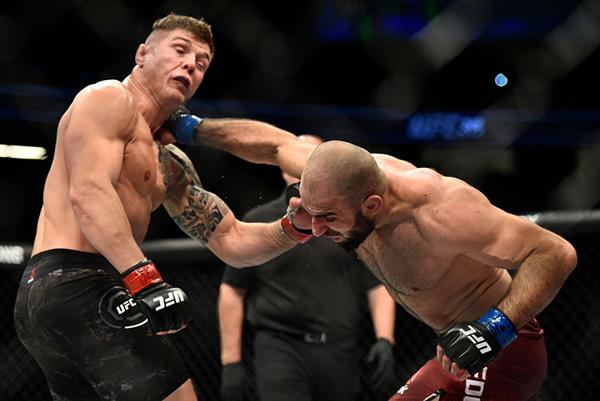 LAS VEGAS, NV - DECEMBER 30: (R-L) Omari Akhmedov of Russia punches Marvin Vettori of Italy in their middleweight bout during the UFC 219 event inside T-Mobile Arena on December 30, 2017 in Las Vegas, Nevada. (Photo by Brandon Magnus/Zuffa LLC)