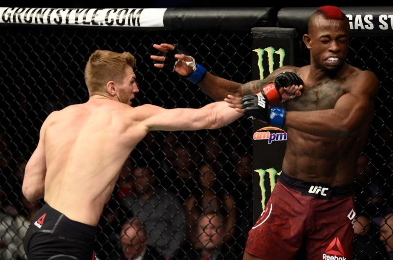LAS VEGAS, NV - DECEMBER 30: (L-R) Dan Hooker of New Zealand punches Marc Diakiese of Congo in their lightweight bout during the UFC 219 event inside T-Mobile Arena on December 30, 2017 in Las Vegas, Nevada. (Photo by Jeff Bottari/Zuffa LLC)