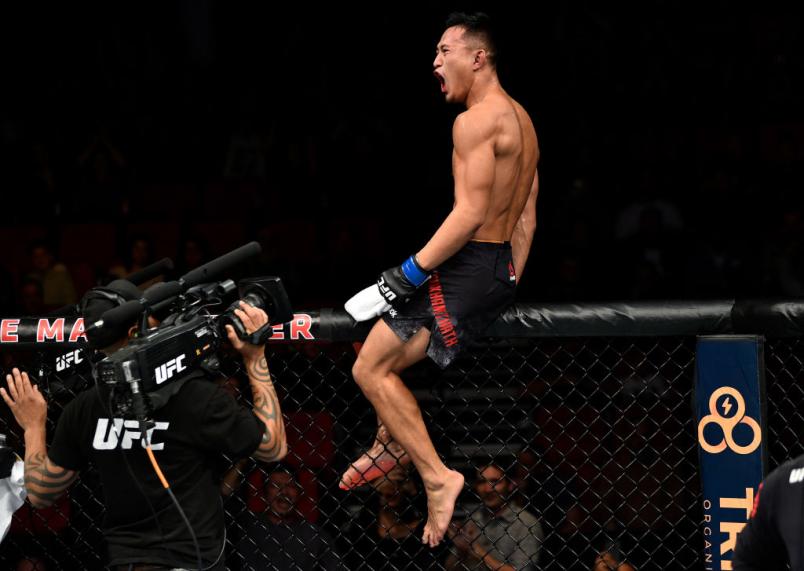 FRESNO, CA - DECEMBER 09: Andre Soukhamthath celebrates his victory over Luke Sanders in their featherweight bout during the UFC Fight Night event inside Save Mart Center on December 9, 2017 in Fresno, California. (Photo by Jeff Bottari/Zuffa LLC/Zuffa L