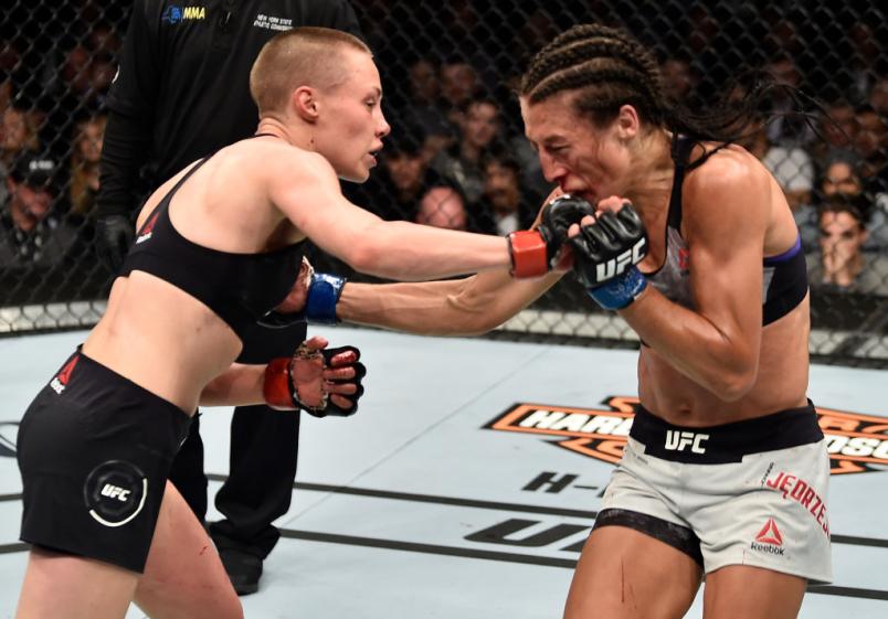 BROOKLYN, NEW YORK - APRIL 07:  (L-R) Rose Namajunas punches Joanna Jedrzejczyk of Poland in their women's strawweight title bout during the UFC 223 event inside Barclays Center on April 7, 2018 in Brooklyn, New York. (Photo by Jeff Bottari/Zuffa LLC/Zuff