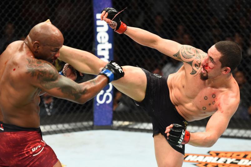 CHICAGO, ILLINOIS - JUNE 09: (R-L) Robert Whittaker of New Zealand lands a kick to the head of Yoel Romero of Cuba in their middleweight fight during the UFC 225 event at the United Center on June 9, 2018 in Chicago, Illinois. (Photo by Josh Hedges/Zuffa