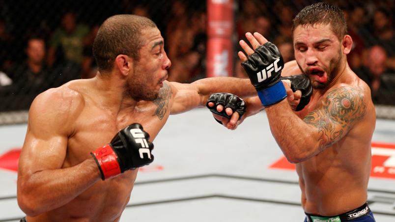 RIO DE JANEIRO, BRAZIL - OCTOBER 25:  (L-R) Jose Aldo of Brazil punches Chad Mendes in their featherweight championship bout during the UFC 179 event at Maracanazinho on October 25, 2014 in Rio de Janeiro, Brazil.  (Photo by Josh Hedges/Zuffa LLC/Zuffa LL