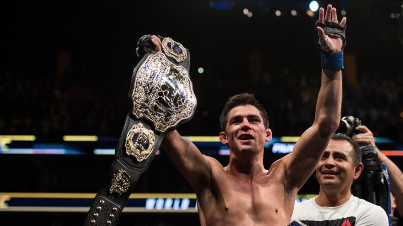 BOSTON, MA - JANUARY 17: Dominick Cruz celebrates his victory over TJ Dillashaw in their UFC bantamweight championship bout during the UFC Fight Night event inside TD Garden on January 17, 2016 in Boston, Massachusetts. (Photo by Brandon Magnus/Zuffa LLC