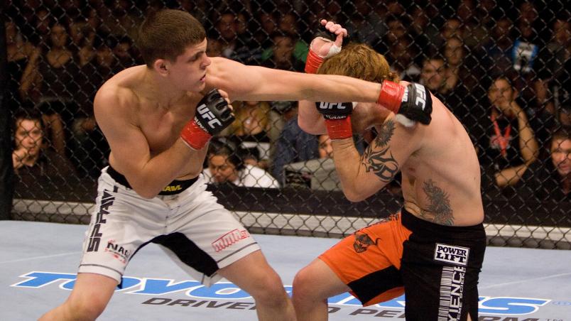 ANAHEIM - SEPTEMBER 23:  (L-R) Joe Lauzon punches Jens Pulver at UFC 63 at the Arrowhead Pond on September 23, 2006 in Anaheim, California.  (Photo by Josh Hedges/Zuffa LLC/Zuffa LLC via Getty Images)