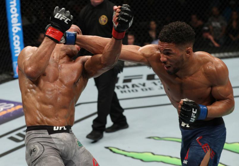 ATLANTIC CITY, NJ - APRIL 21: (R-L) Kevin Lee punches Edson Barboza of Brazil in their lightweight fight during the UFC Fight Night event at the Boardwalk Hall on April 21, 2018 in Atlantic City, New Jersey. (Photo by Patrick Smith/Zuffa LLC/Zuffa LLC vi