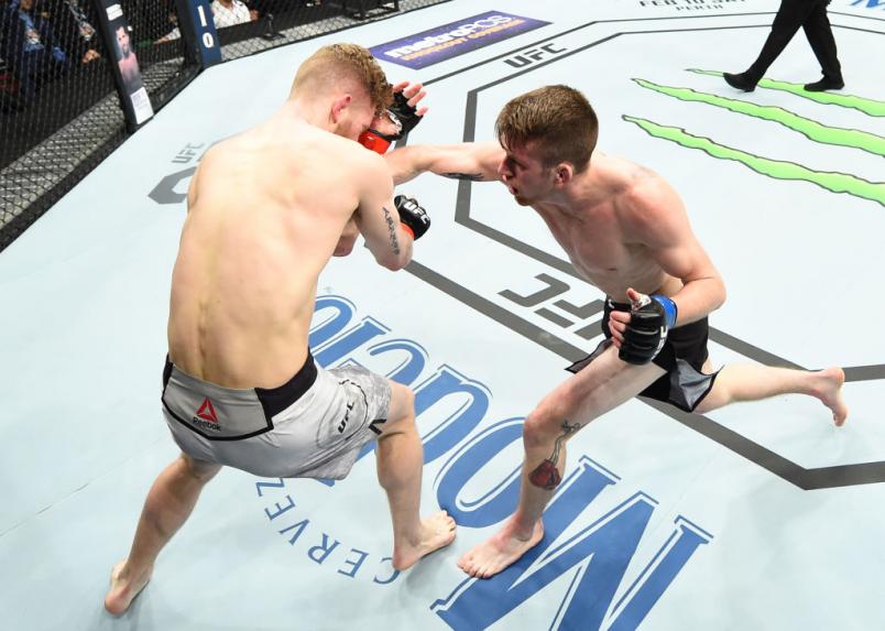 CHARLOTTE, NC - JANUARY 27: (R-L) Cory Sandhagen punches Austin Arnett in their featherweight bout during a UFC Fight Night event at Spectrum Center on January 27, 2018 in Charlotte, North Carolina. (Photo by Josh Hedges/Zuffa LLC/Zuffa LLC via Getty Im