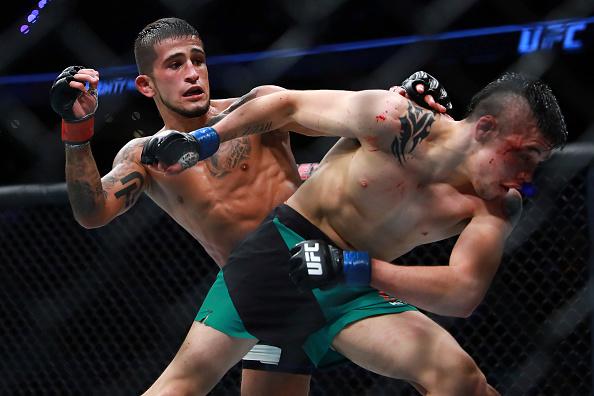 MEXICO CITY, MEXICO - AUGUST 05: Sergio Pettis punches Brandon Moreno during the UFC Fight Night Mexico City at Arena Ciudad de Mexico on August 05, 2017 in Mexico City, Mexico. (Photo by Hector Vivas/Getty Images)