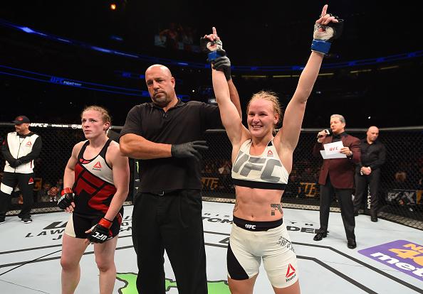 ORLANDO, FL - DECEMBER 19: (R-L) Valentina Shevchenko celebrates her victory over Sarah Kaufman in their women's bantamweight bout during the UFC Fight Night event at the Amway Center on December 19, 2015 in Orlando, Florida. (Photo by Josh Hedges/Zuffa
