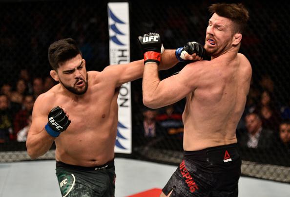 SHANGHAI, CHINA - NOVEMBER 25:  Kelvin Gastelum punches Michael Bisping of England in their middleweight bout during the UFC Fight Night event inside the Mercedes-Benz Arena on November 25, 2017 in Shanghai, China. (Photo by Brandon Magnus/Zuffa LLC via G