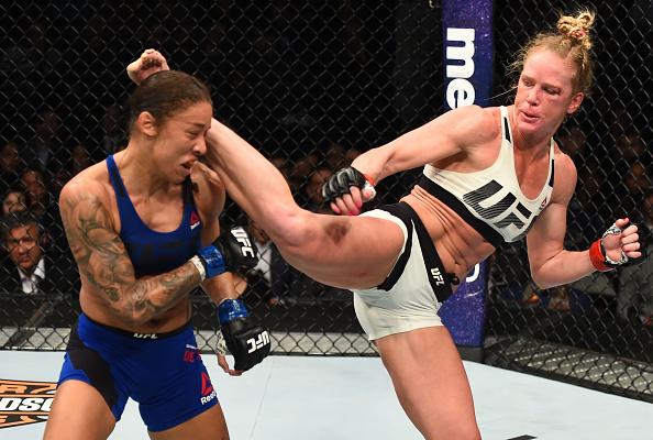 BROOKLYN, NEW YORK - FEBRUARY 11: (R-L) Holly Holm kicks Germaine de Randamie of The Netherlands in their women's featherweight championship bout during the UFC 208 event inside Barclays Center on February 11, 2017 in Brooklyn, New York. (Photo by Jeff B