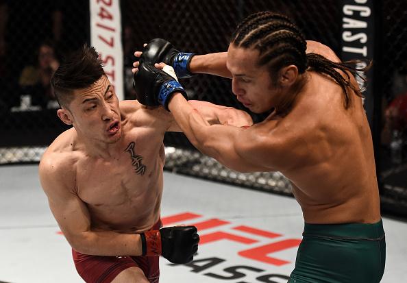 LAS VEGAS, NV - JULY 11: (L-R) Boston Salmon punches Ricky Turcios in their bantamweight bout during Dana White's Tuesday Night Contender Series at the TUF Gym on July 11, 2017 in Las Vegas, Nevada. (Photo by Brandon Magnus/DWTNCS)
