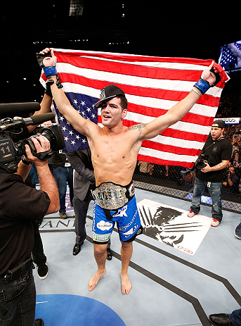 LAS VEGAS, NV - JULY 06: Chris Weidman reacts to his victory over Anderson Silva in their UFC middleweight championship fight during the UFC 162 event inside the MGM Grand Garden Arena on July 6, 2013 in Las Vegas, Nevada. (Photo by Josh Hedges/Zuffa LL