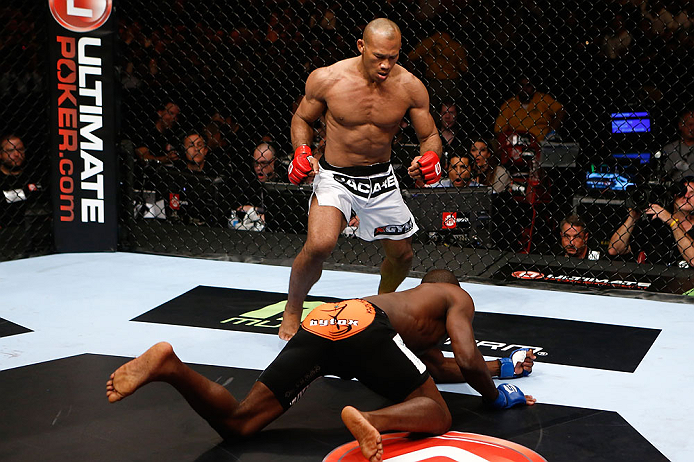 SAN DIEGO, CA - AUGUST 18: Ronaldo "Jacare" Souza (white shorts) stands over Derek Brunson after knocking him down with a punch during the Strikeforce event at Valley View Casino Center on August 18, 2012 in San Diego, California. (Photo by Esther Lin/Fo
