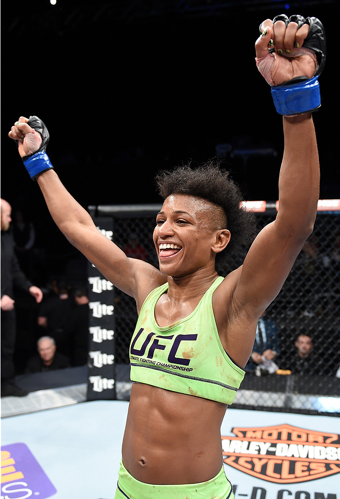 LAS VEGAS, NEVADA - DECEMBER 12: Angela Hill reacts after her victory over Emily Kagan in their strawweight fight during The Ultimate Fighter Finale event inside the Pearl concert theater at the Palms Casino Resort on December 12, 2014 in Las Vegas, Nevad