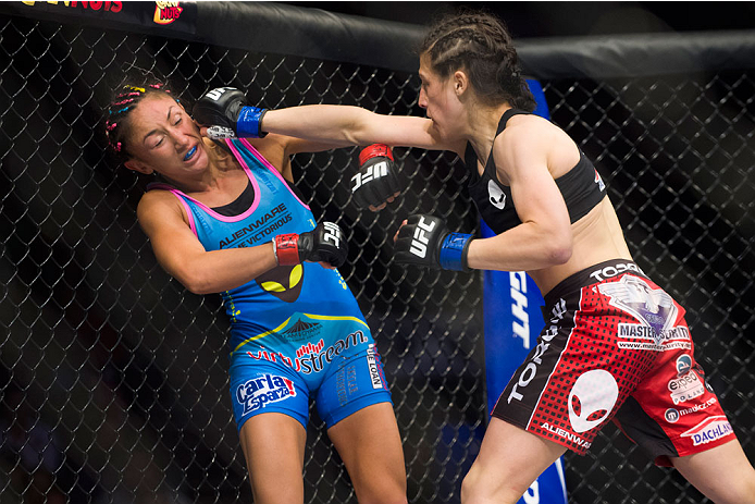 DALLAS, TX - MARCH 14: Joanna Jedrzejczyk throws a punch at Carla Esparza during UFC 185 at the American Airlines Center on March 14, 2015 in Dallas, Texas. (Photo by Cooper Neill/Zuffa LLC/Zuffa LLC via Getty Images)