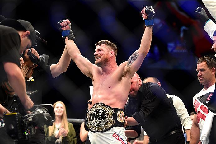 INGLEWOOD, CA - JUNE 04: Michael Bisping of England celebrates after his first round knockout win against Luke Rockhold in their UFC middleweight championship bout during the UFC 199 event at The Forum on June 4, 2016 in Inglewood, California. (Photo by