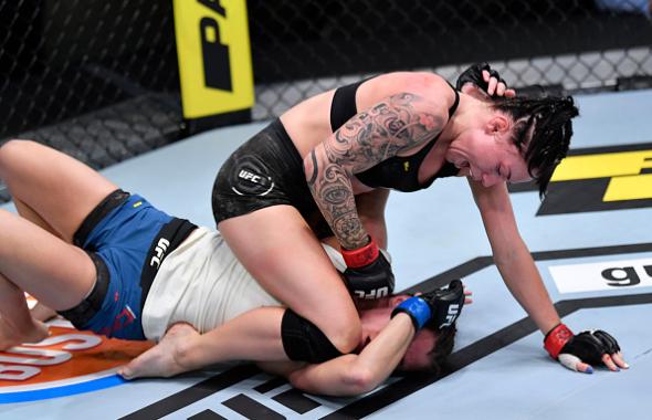 Mallory Martin punches Hannah Cifers in their strawweight fight during the UFC Fight Night event at UFC APEX on August 29, 2020 in Las Vegas, Nevada. (Photo by Jeff Bottari/Zuffa LLC)