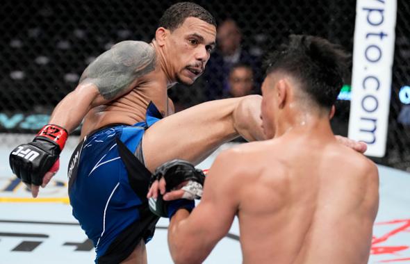 Journey Newson kicks Fernie Garcia in a bantamweight fight during the UFC 274 event at Footprint Center on May 07, 2022 in Phoenix, Arizona. (Photo by Chris Unger/Zuffa LLC)