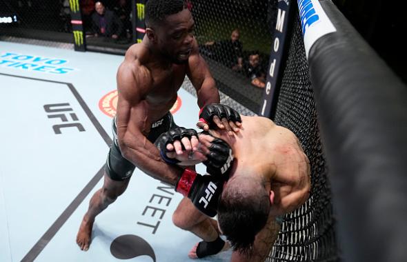 Dalcha Lungiambula of South Africa punches Cody Brundage in their middleweight fight during the UFC Fight Night event at UFC APEX on March 12, 2022 in Las Vegas, Nevada. (Photo by Chris Unger/Zuffa LLC)