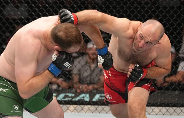 Aleksei Oleinik of Russia punches Jared Vanderaa in their heavyweight fight during the UFC 273 event at VyStar Veterans Memorial Arena on April 09, 2022 in Jacksonville, Florida. (Photo by Jeff Bottari/Zuffa LLC)