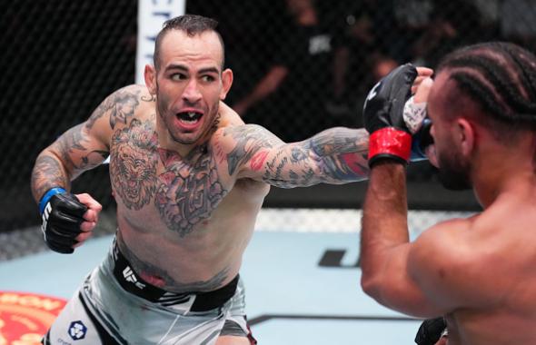 Yohan Lainesse of Canada punches Gabe Green in a welterweight fight during the UFC Fight Night event at UFC APEX on April 30, 2022 in Las Vegas, Nevada. (Photo by Chris Unger/Zuffa LLC)