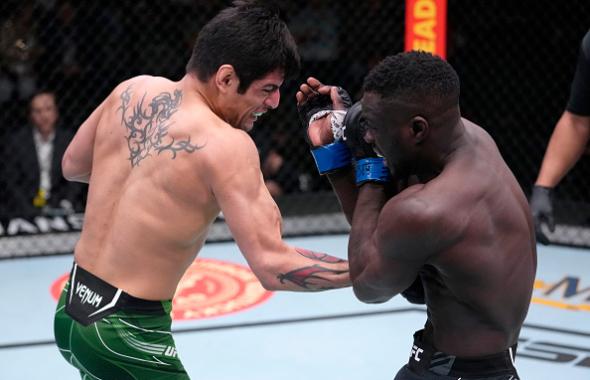 Gabriel Benitez of Mexico punches David Onama of Uganda in their featherweight fight during the UFC Fight Night event at UFC APEX on February 19, 2022 in Las Vegas, Nevada. (Photo by Jeff Bottari/Zuffa LLC)