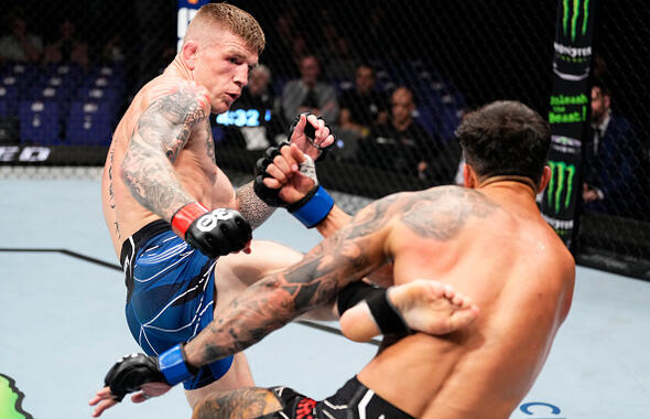 Chris Duncan of Scotland kicks Omar Morales of Venezuela in a lightweight fight during the UFC 286 event at The O2 Arena on March 18, 2023 in London, England. (Photo by Jeff Bottari/Zuffa LLC)