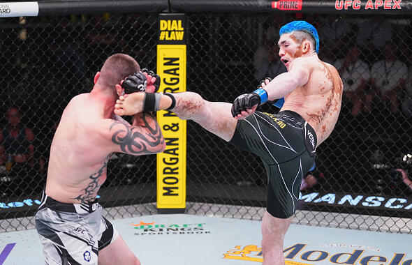 Melquizael Costa kicks Austin Lingo in their featherweight fight during the UFC Fight Night at UFC APEX on July 15, 2023 in Las Vegas, Nevada. (Photo by Jeff Bottari/Zuffa LLC)