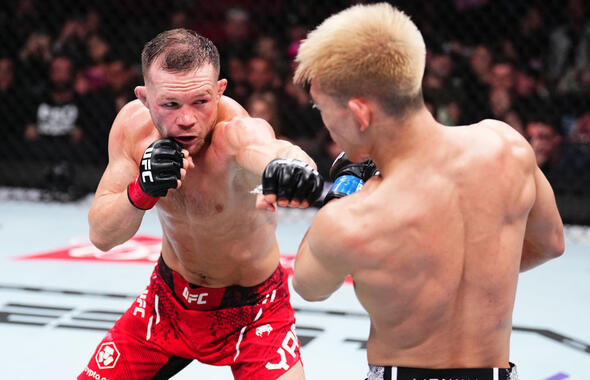 Petr Yan of Russia punches Song Yadong of China in a bantamweight fight during the UFC 299 event at Kaseya Center on March 09, 2024 in Miami, Florida. (Photo by Chris Unger/Zuffa LLC)