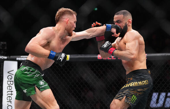 Jack Della Maddalena of Australia punches Belal Muhammad in the UFC welterweight championship bout during the UFC 315 event at Bell Centre on May 10, 2025 in Montreal, Quebec. (Photo by Cooper Neill/Zuffa LLC)