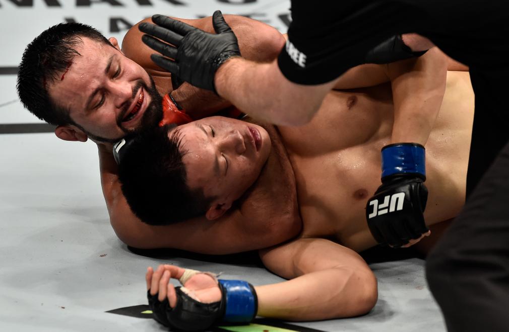 PERTH, AUSTRALIA - FEBRUARY 11: (L-R) Jussier Formiga of Brazil submits Ben Nguyen in their flyweight bout during the UFC 221 event at Perth Arena on February 11, 2018 in Perth, Australia. (Photo by Jeff Bottari/Zuffa LLC/Zuffa LLC via Getty Images)