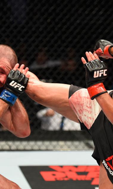 LAS VEGAS, NV - JULY 08:  (R-L) Anthony Pettis kicks Jim Miller in their lightweight bout during the UFC 213 event at T-Mobile Arena on July 8, 2017 in Las Vegas, Nevada.  (Photo by Josh Hedges/Zuffa LLC/Zuffa LLC via Getty Images)