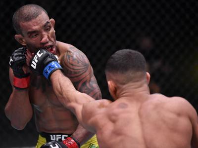 Khalid Taha of Germany punches Raoni Barcelos of Brazil in a bantamweight fight during the UFC Fight Night event at UFC APEX on November 07, 2020 in Las Vegas, Nevada. (Photo by Jeff Bottari/Zuffa LLC)
