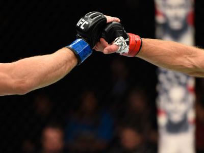 Zak Ottow and Joshua Burkman touch gloves in their welterweight bout during the UFC Fight Night event at the Moda Center on October 1, 2016 in Portland, Oregon. (Photo by Josh Hedges/Zuffa LLC)