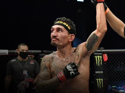 Max Holloway celebrates after his unanimous-decision victory over Calvin Kattar in a featherweight bout during the UFC Fight Night event at Etihad Arena on UFC Fight Island on January 17, 2021 in Abu Dhabi, United Arab Emirates. (Photo by Jeff Bottari/Zuffa LLC)