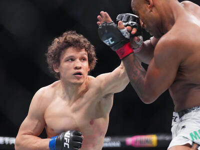 Roman Kopylov of Russia punches Cesar Almeida of Brazil in a middleweight fight during the UFC 302 event at Prudential Center on June 01, 2024 in Newark, New Jersey. (Photo by Cooper Neill/Zuffa LLC)