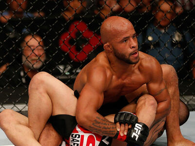  Demetrious Johnson (top) attempts to submit John Moraga in their flyweight championship bout during the UFC on FOX event at Key Arena on July 27, 2013 in Seattle, Washington. (Photo by Josh Hedges/Zuffa LLC/Zuffa LLC)