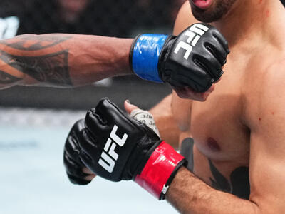 Raoni Barcelos of Brazil punches Payton Talbott in a bantamweight fight during the UFC 311 event at Intuit Dome on January 18, 2025 in Inglewood, California