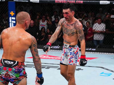 Max Holloway gestures to Dustin Poirier in the final minute of the BMF championship bout during the UFC 318 event at Smoothie King Center on July 19, 2025 in New Orleans, Louisiana. (Photo by Cooper Neill/Zuffa LLC)